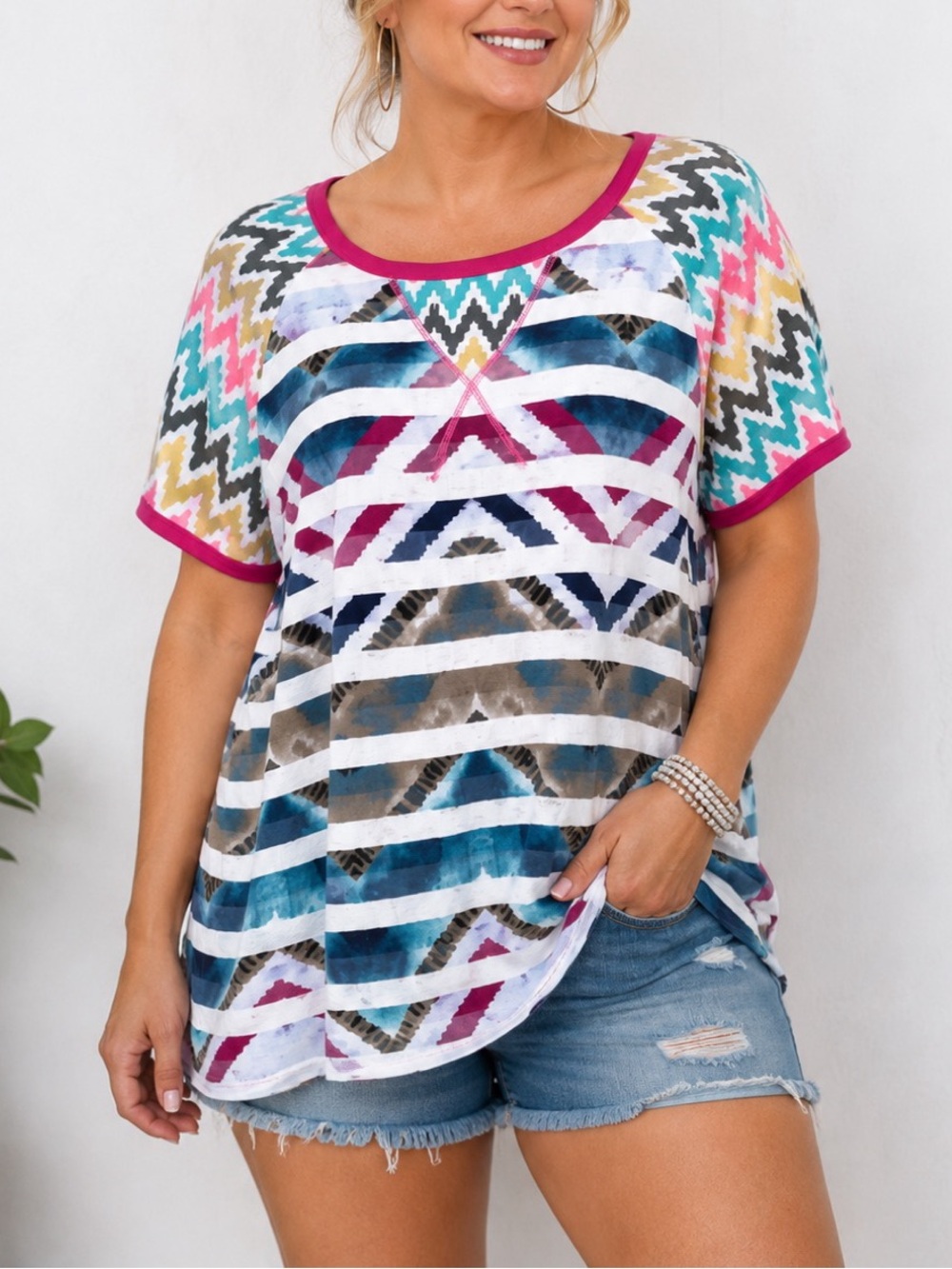 Celeste Colorful women’s short-sleeve top featuring a bold geometric and chevron